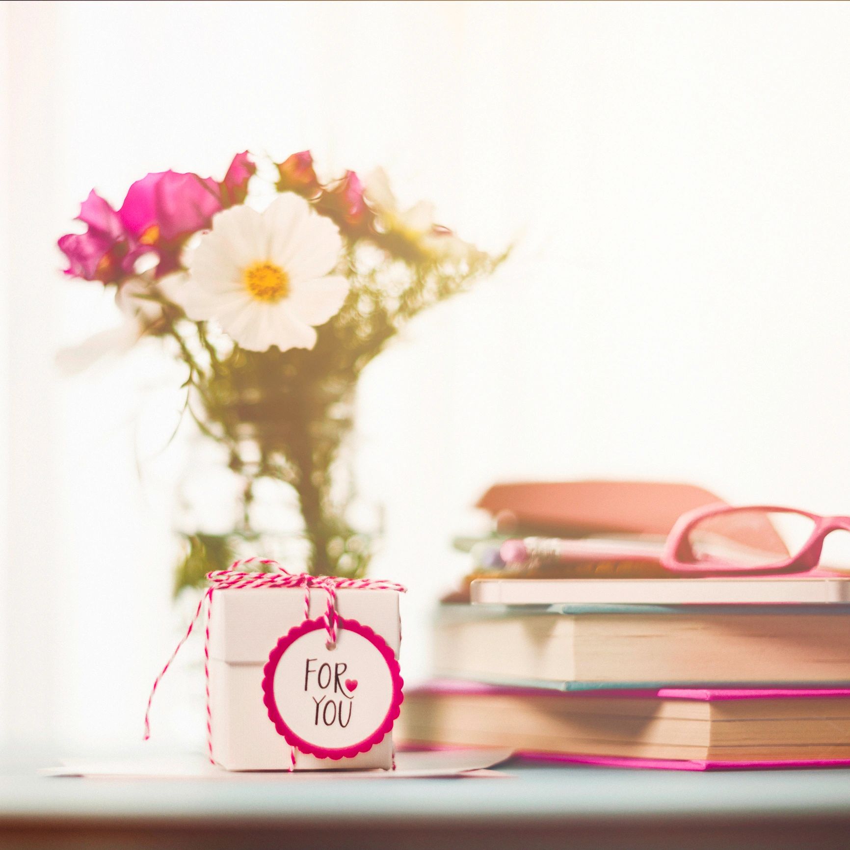 Delicate flowers arranged on a desk for a gentle still life